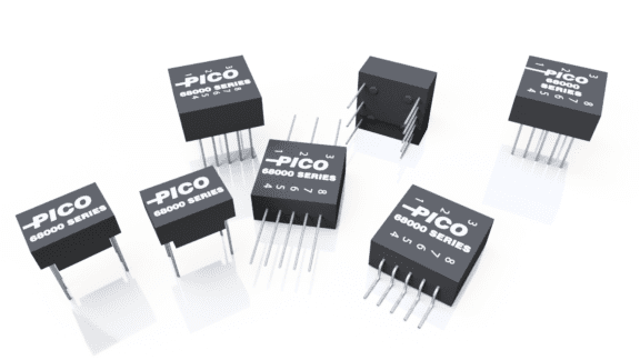 An array of black PICO 68000 Series integrated circuit chips with silver pins, positioned on a reflective white surface.